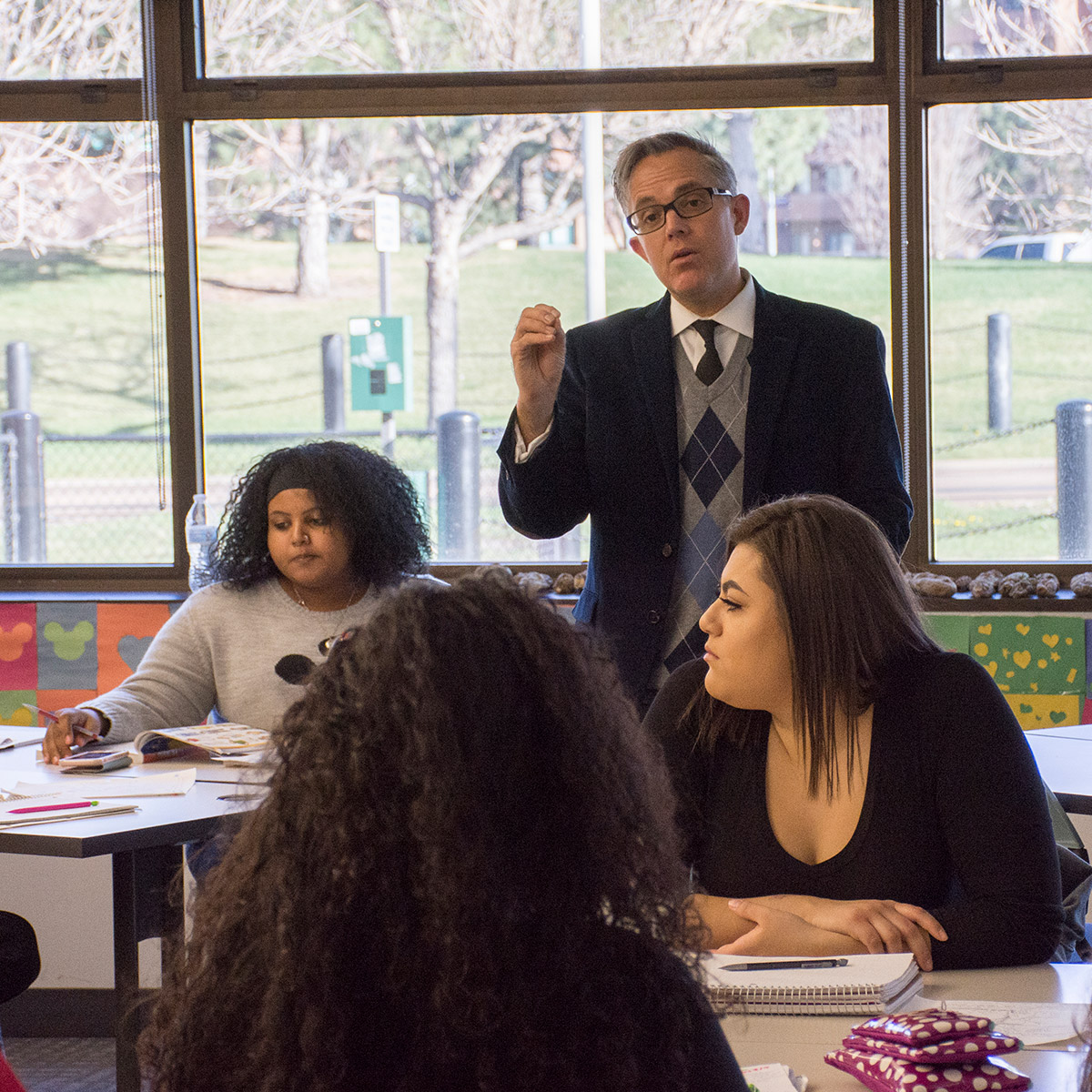 male professor in a classroom with students