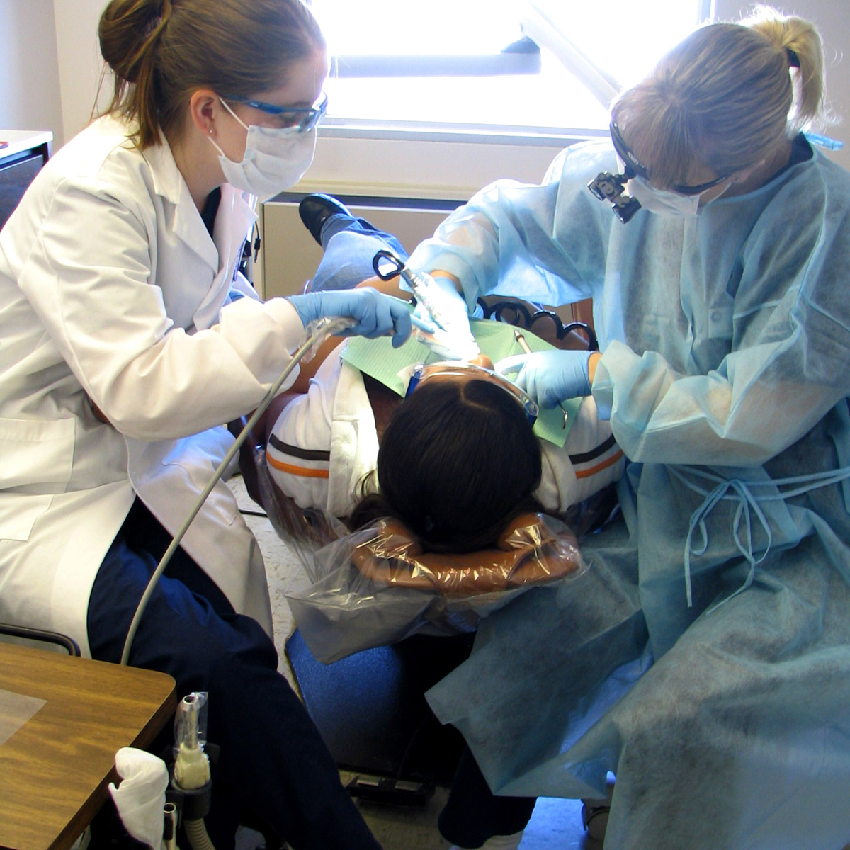 CCD Dental Hygiene students with a patient