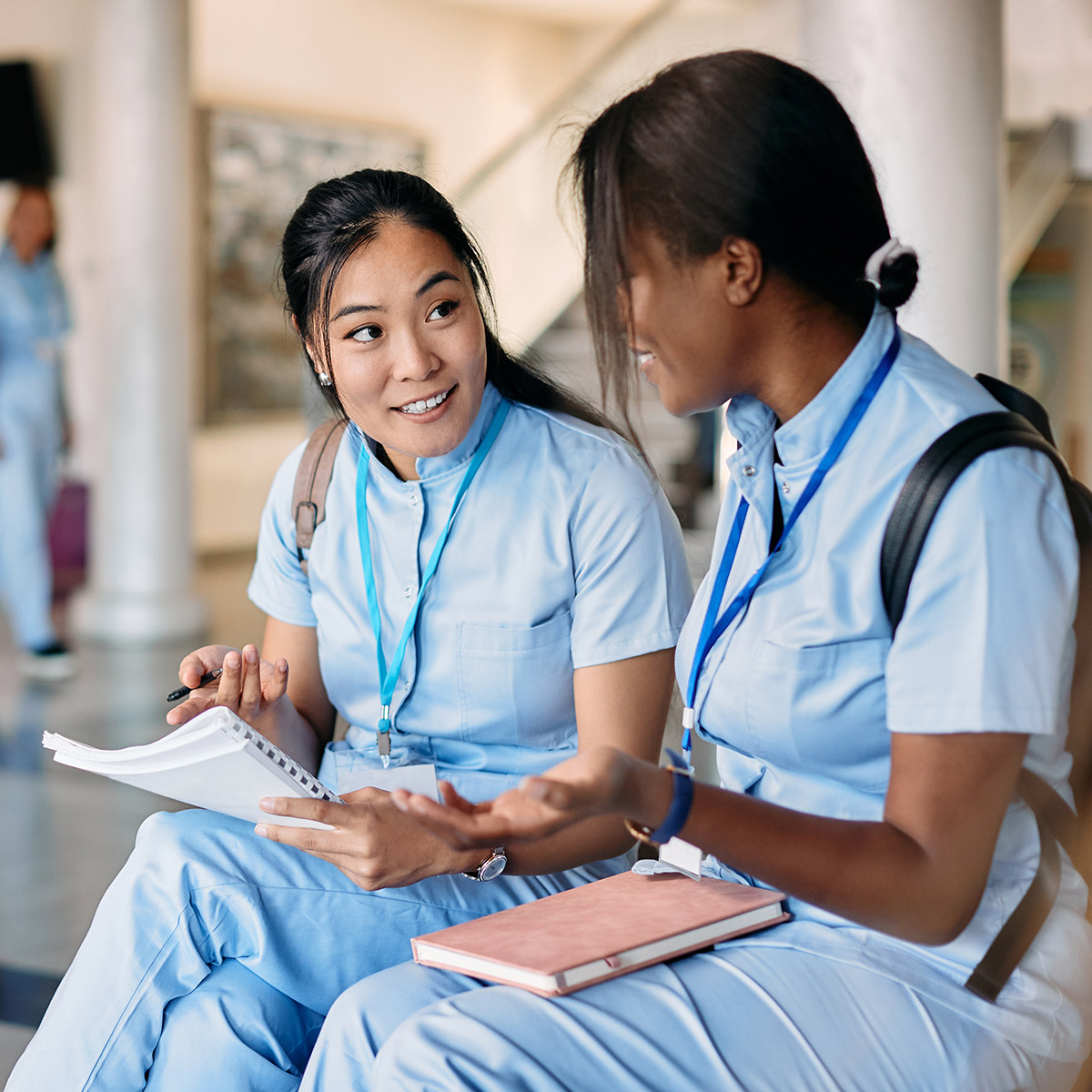 2 CCD health sciences students sitting and chatting