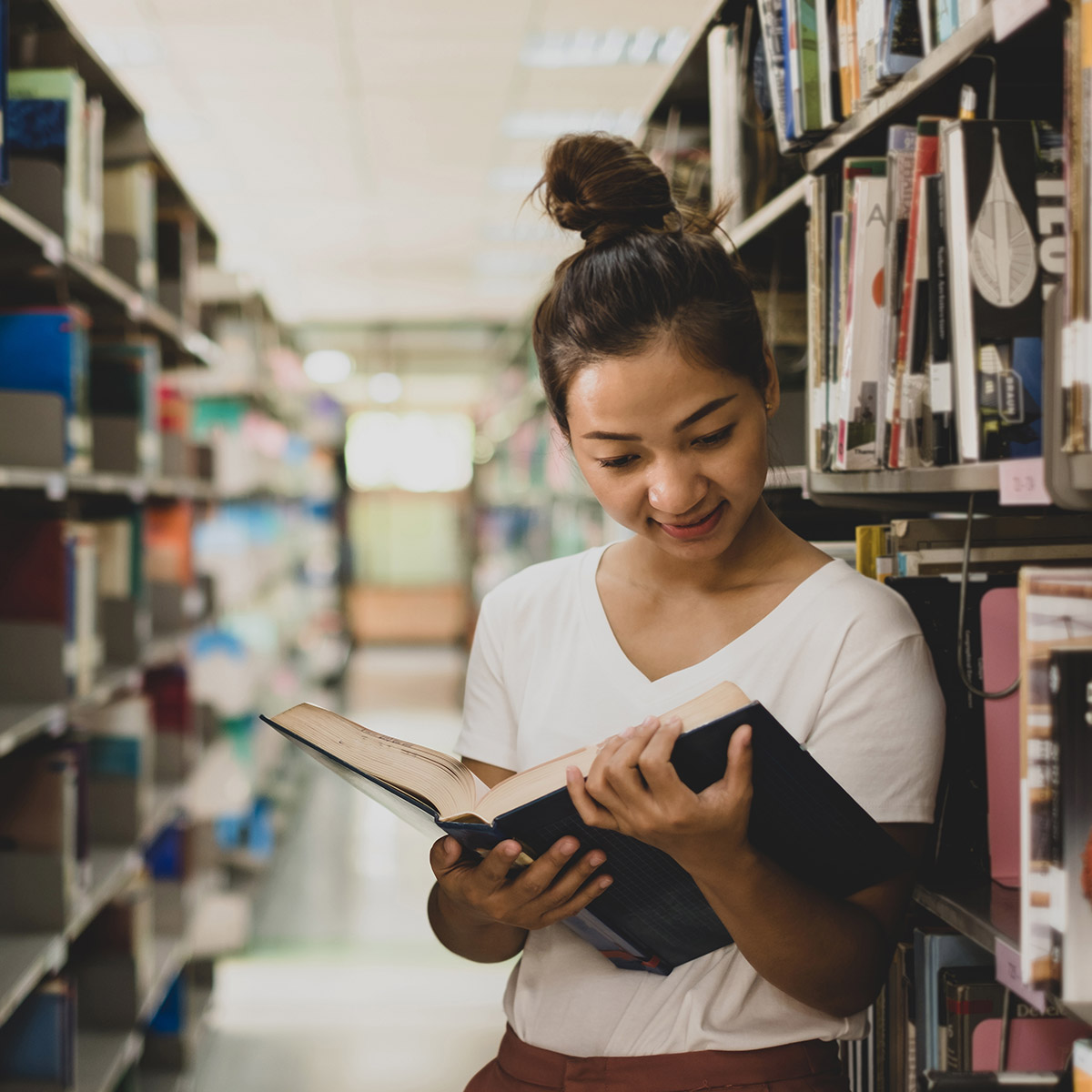 CCD History student reading in the library