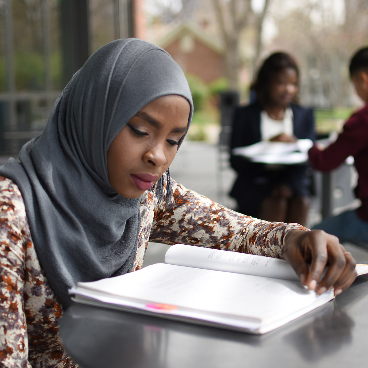 female CCD student reading a book