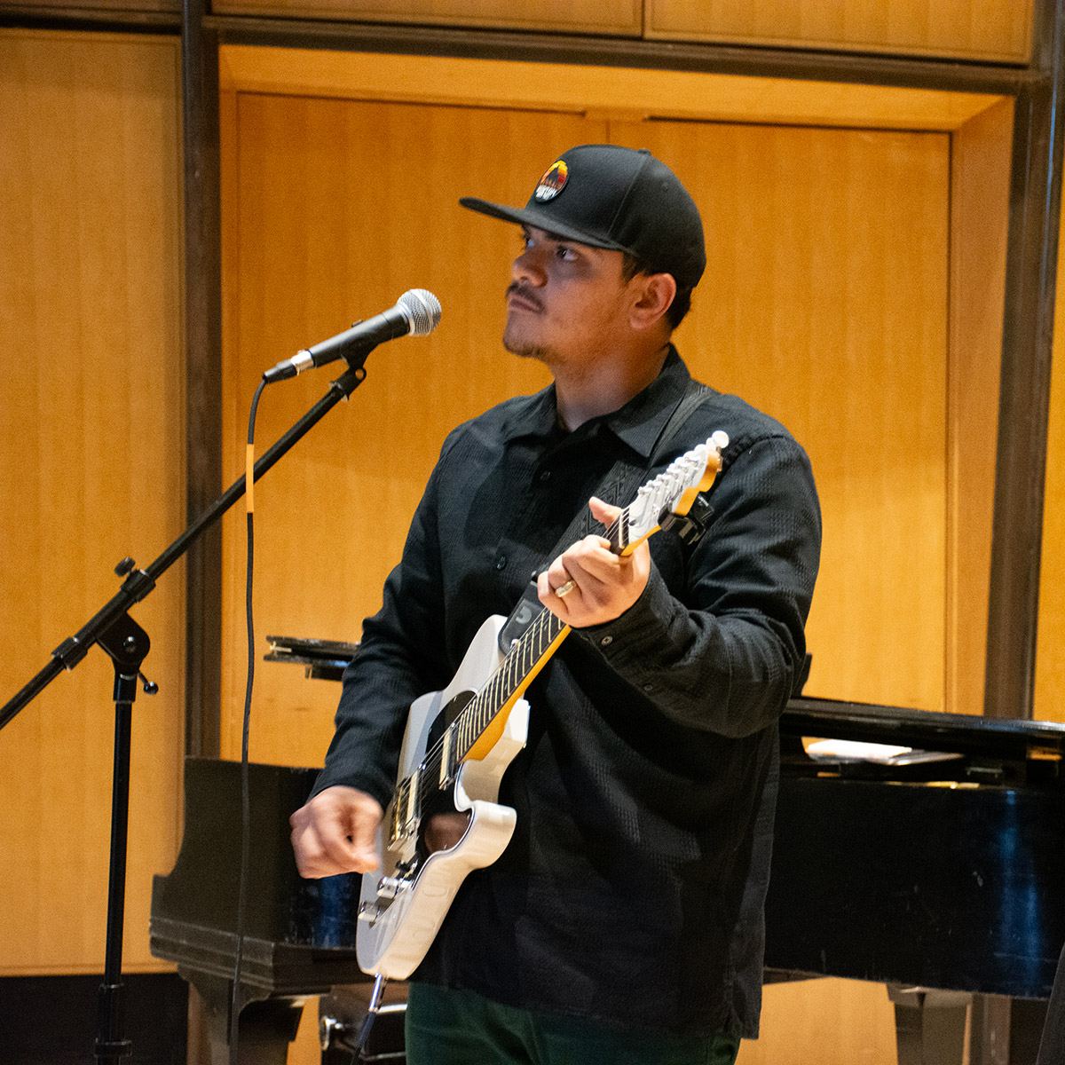 CCD Music student playing guitar and singing