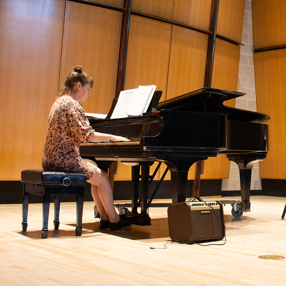 CCD Music student playing piano on stage
