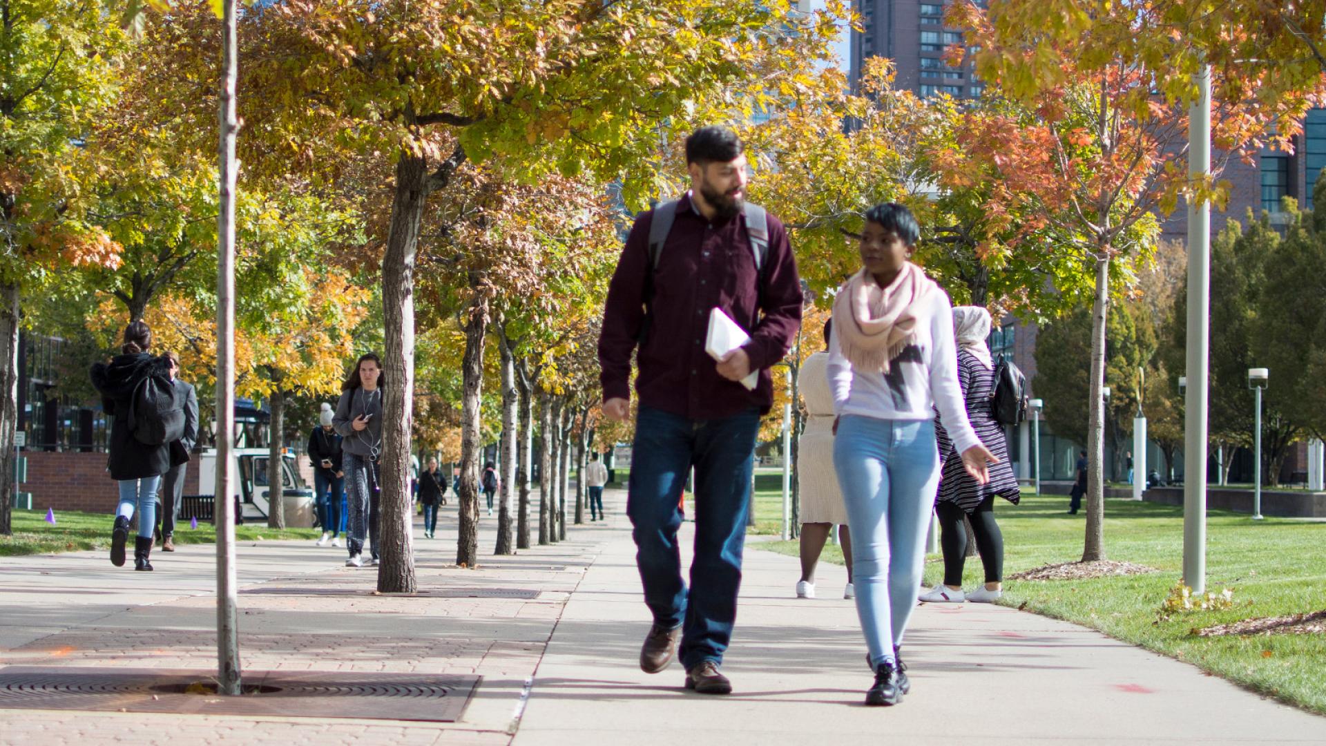 students walking across CCD campus