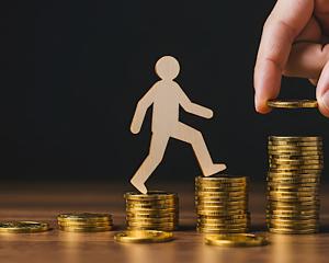 stock photo of coins and person walking on them