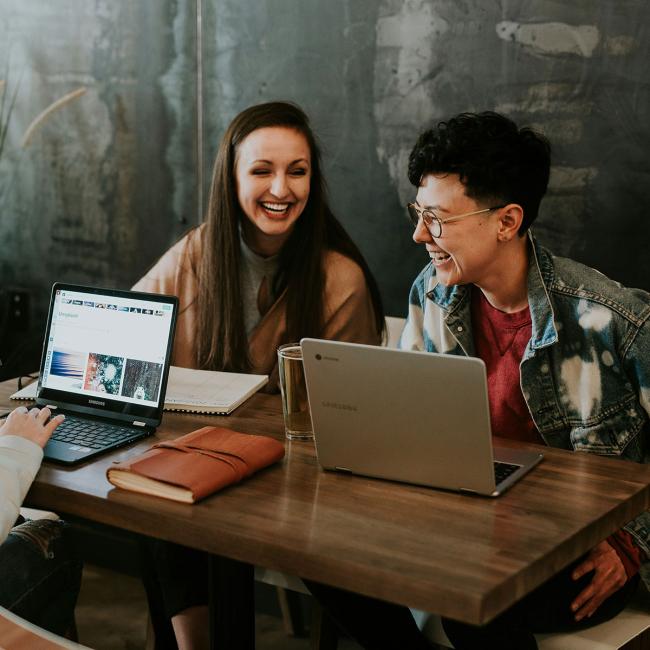 people working around a desk